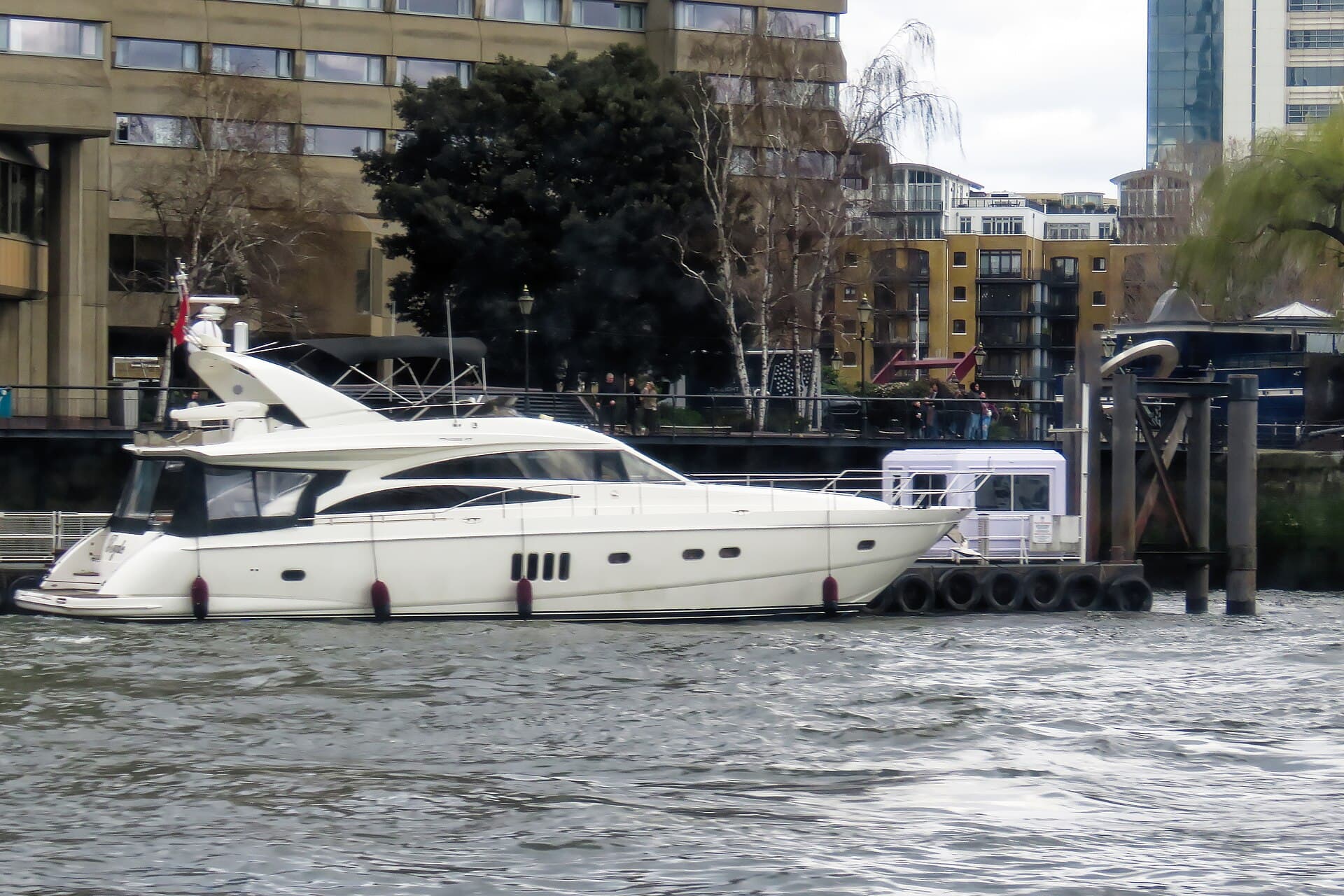A motor yacht on the Thames off St Katharine Docks