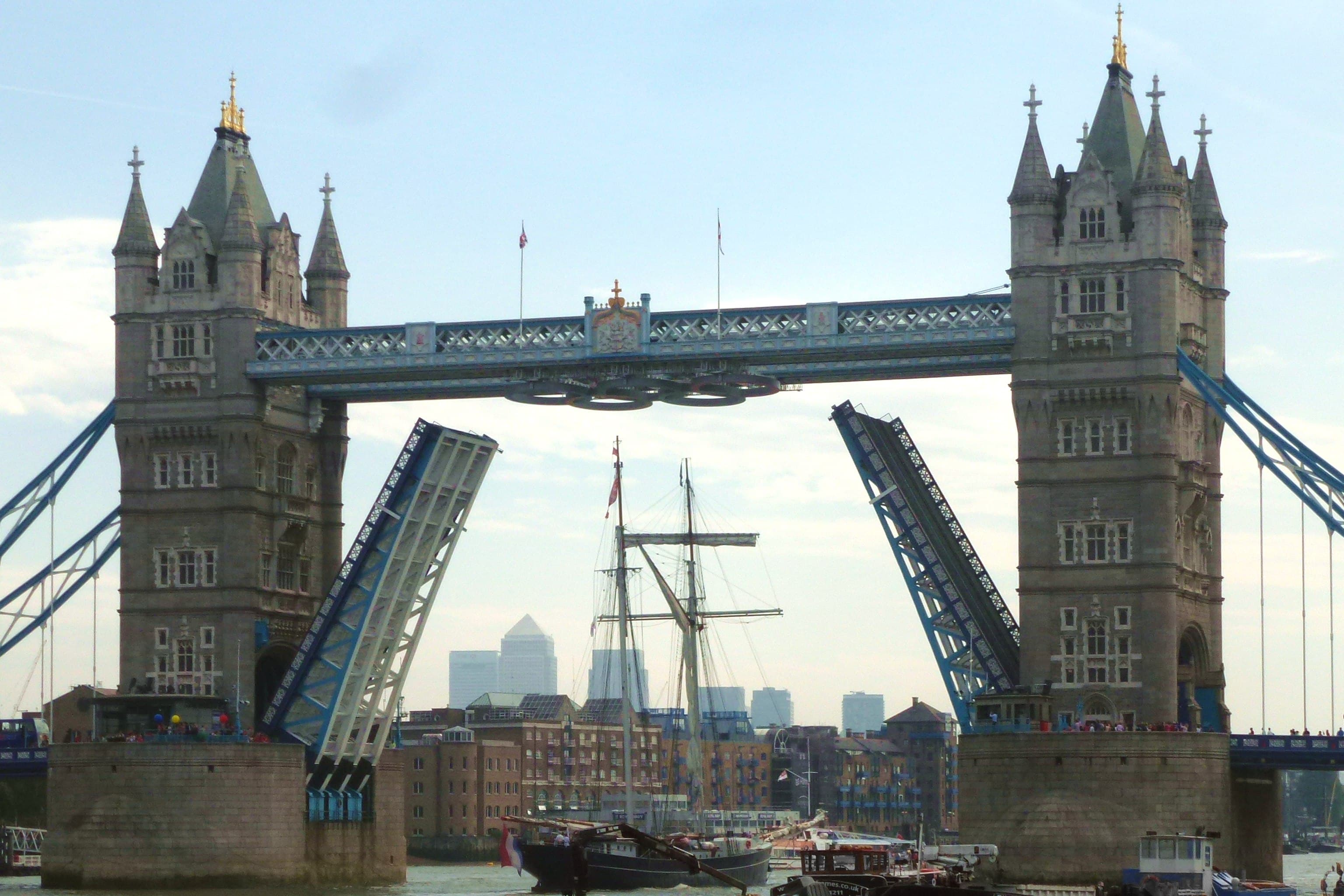 Tower Bridge raised for a tall ship bound downriver