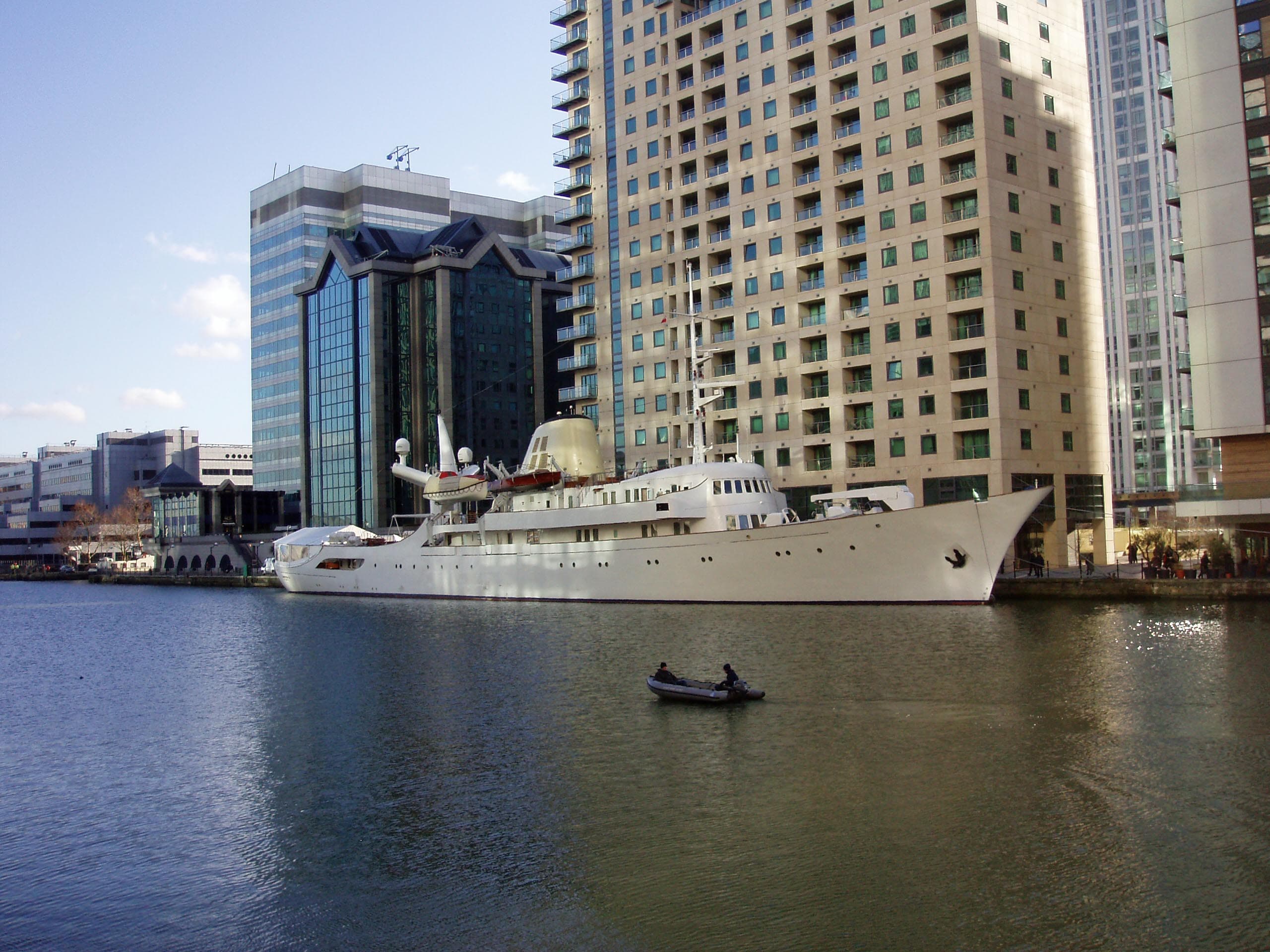 A classic motor yacht lying alongside at Canary Wharf