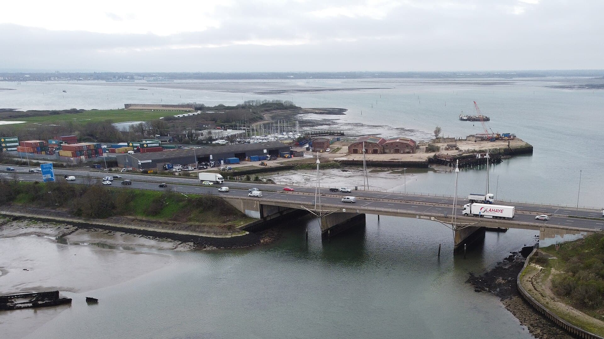 Tipner West and Tipner Point from the air, with the M275 bridge in the foreground and Portsmouth Harbour beyond