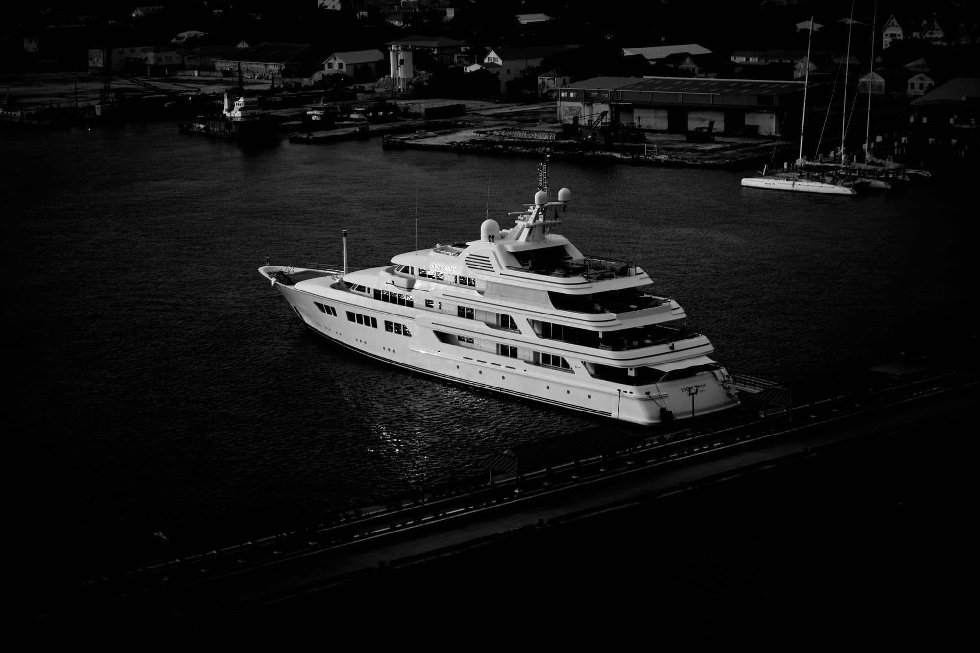A superyacht alongside at night
