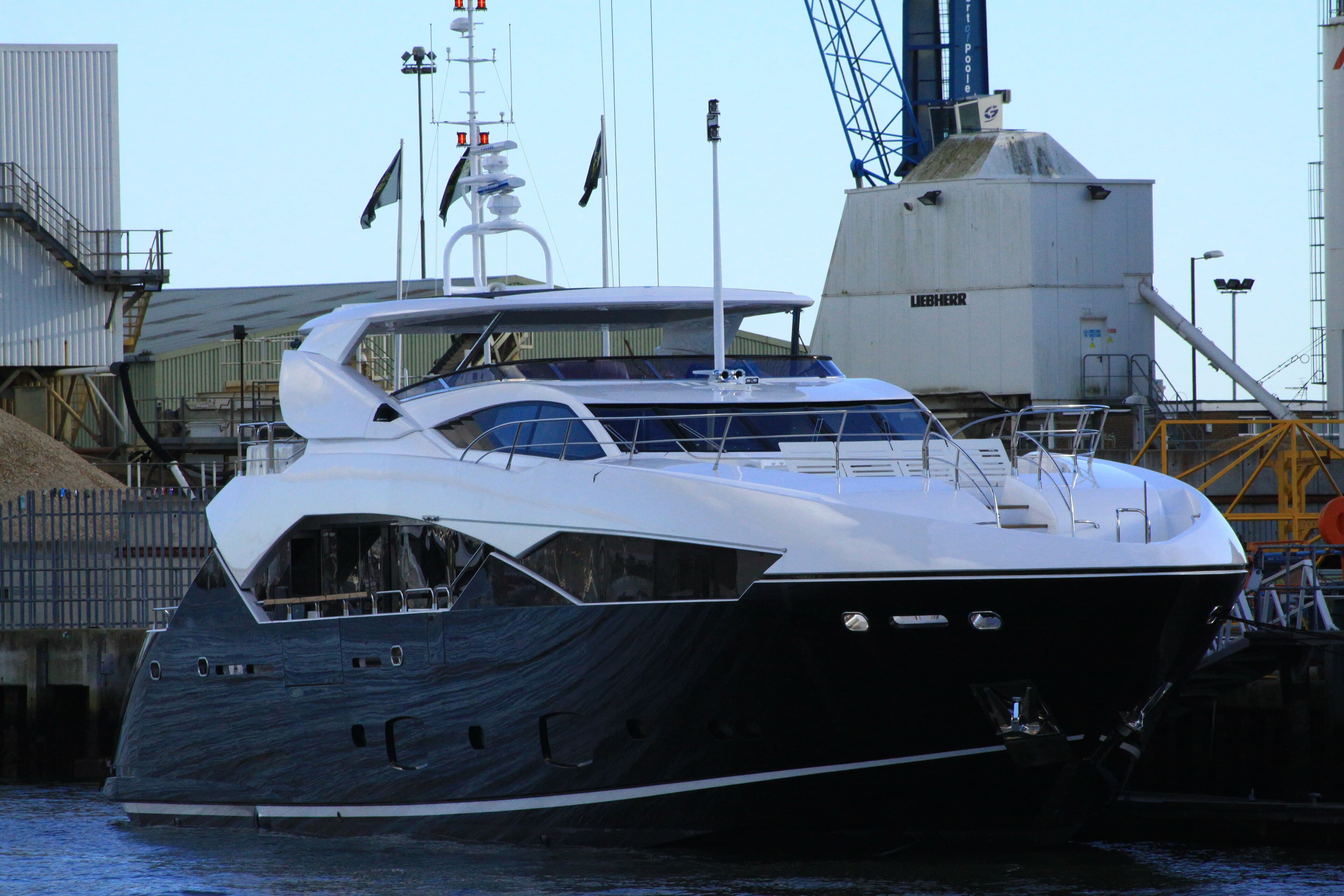 A new motor yacht alongside the Sunseeker yard at Poole